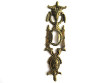 Antique escutcheon with Buck-Ram, keyhole frame, solid brass.