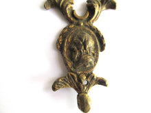 Antique escutcheon with Buck-Ram, keyhole frame, solid brass.