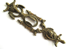 Antique escutcheon with Buck-Ram, keyhole frame, solid brass.