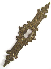 UpperDutch:Keyhole cover,1 (one) Stamped Escutcheon, Antique Brass Ornate Keyhole cover / plate.