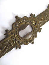 UpperDutch:Keyhole cover,1 (one) Stamped Escutcheon, Antique Brass Ornate Keyhole cover / plate.