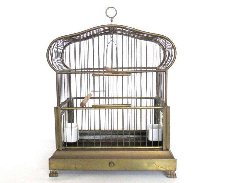 An antique bird cage with feeder bowls - brass, glass, porcelain
